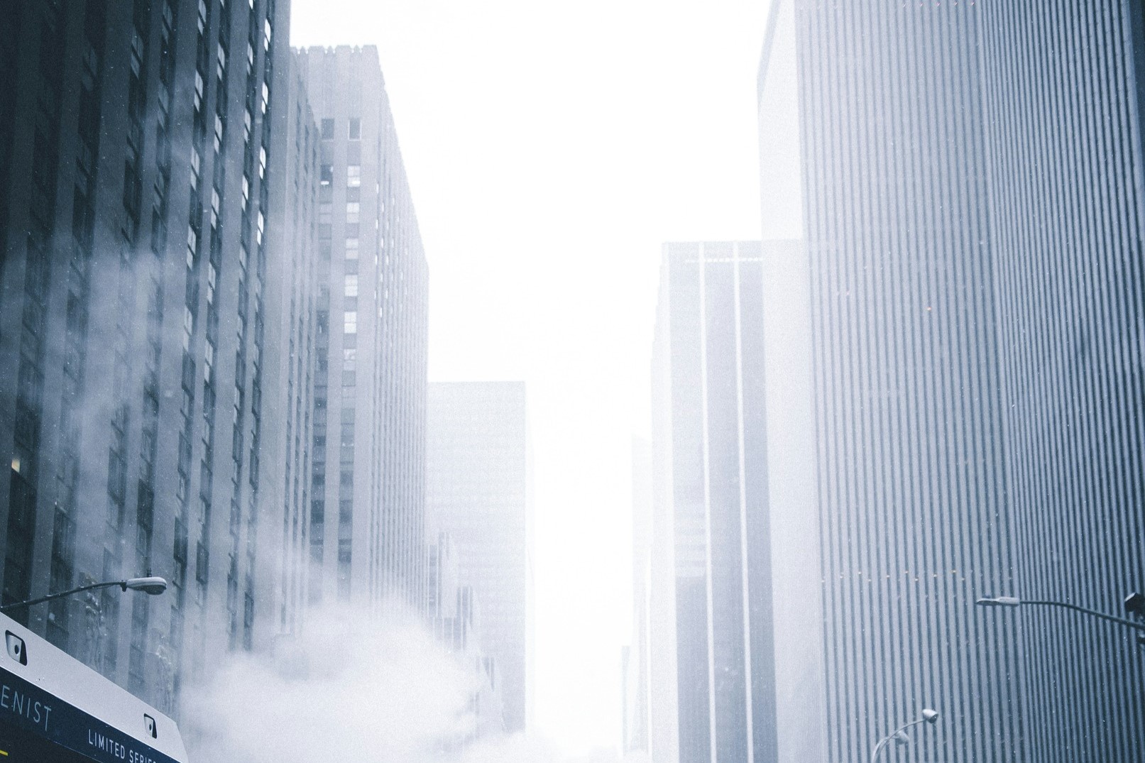 https://unsplash.com/photos/a-city-street-filled-with-traffic-next-to-tall-buildings-ZgpNga85Sjc