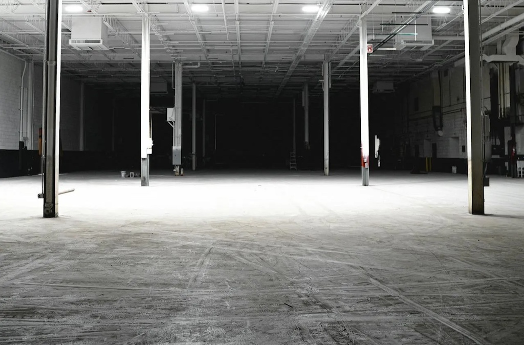Black and white photo of empty warehouse