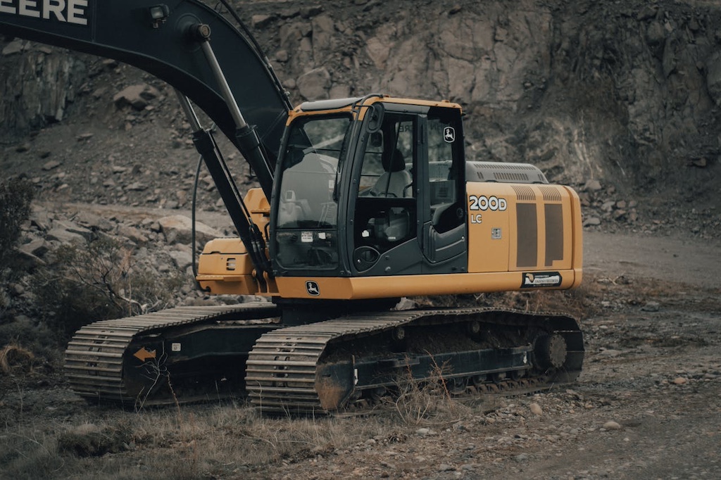 Yellow backhoe with gear driven track