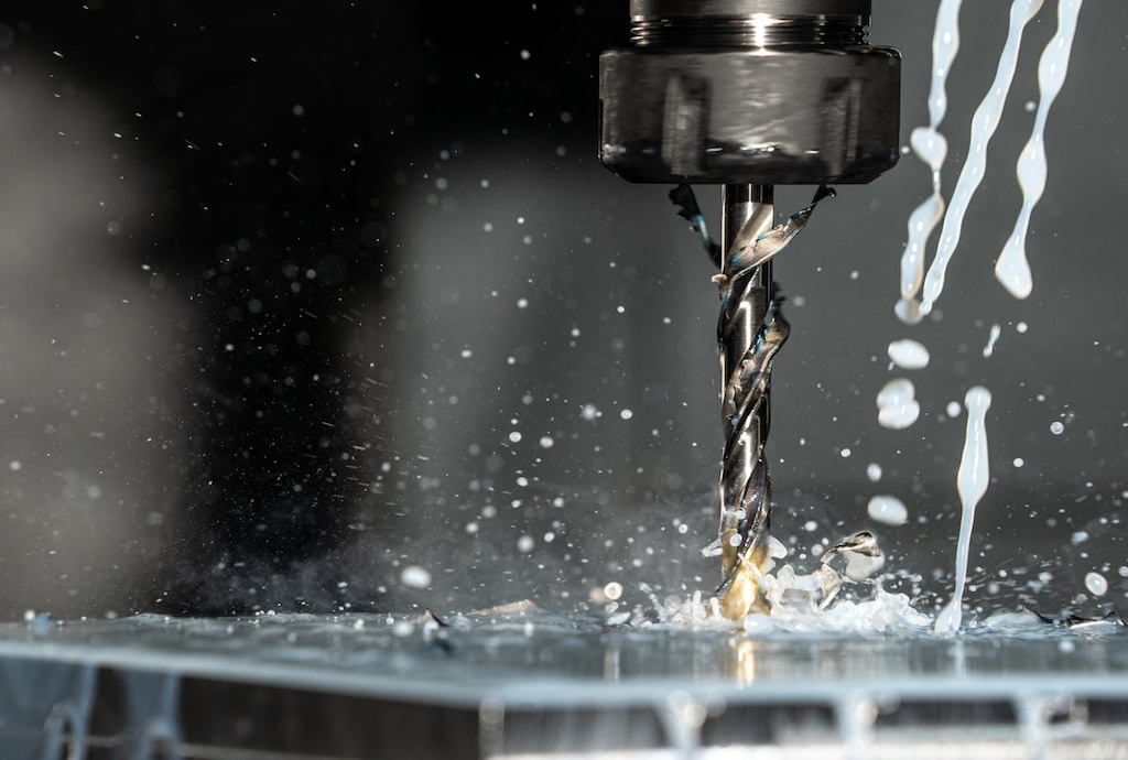 Close up photo of a cnc milling machine with metalworking fluid