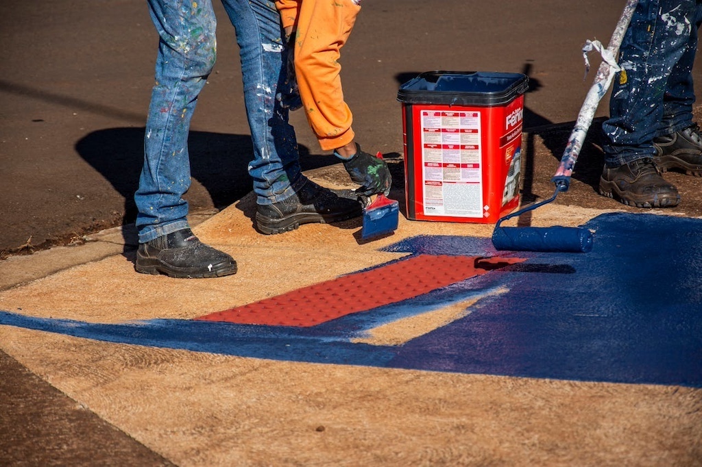 Men painting pavement