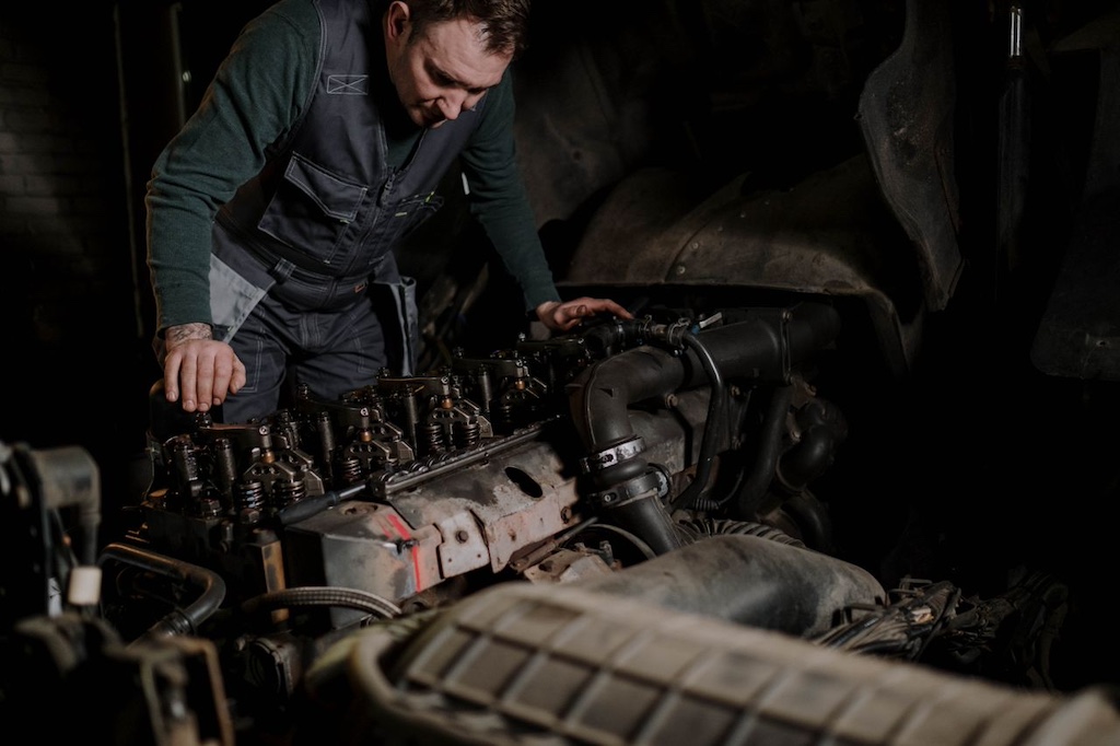 Mechanic repairing a truck engine