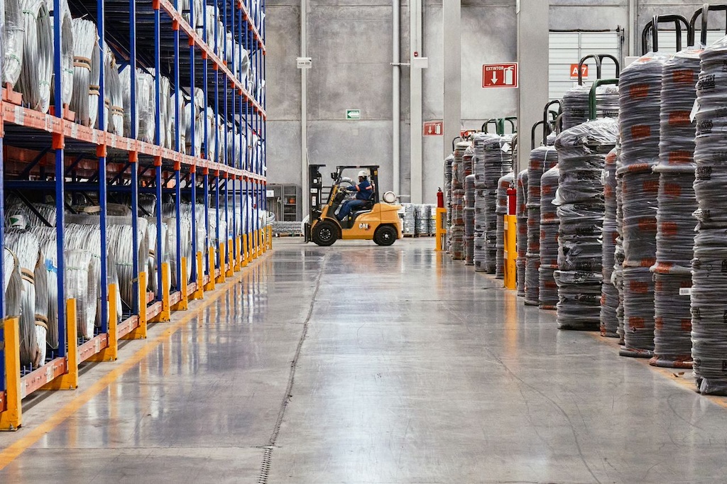Industrial warehouse with forklift and shelving