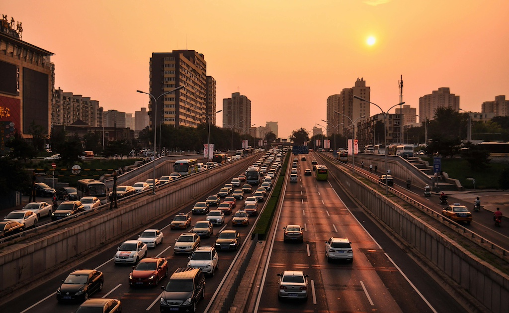 vehicles in road at golden hour